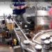 FlexPackPRO 130 Series TTO Coder on Quadrel Labeler in Preserves Packaging Line